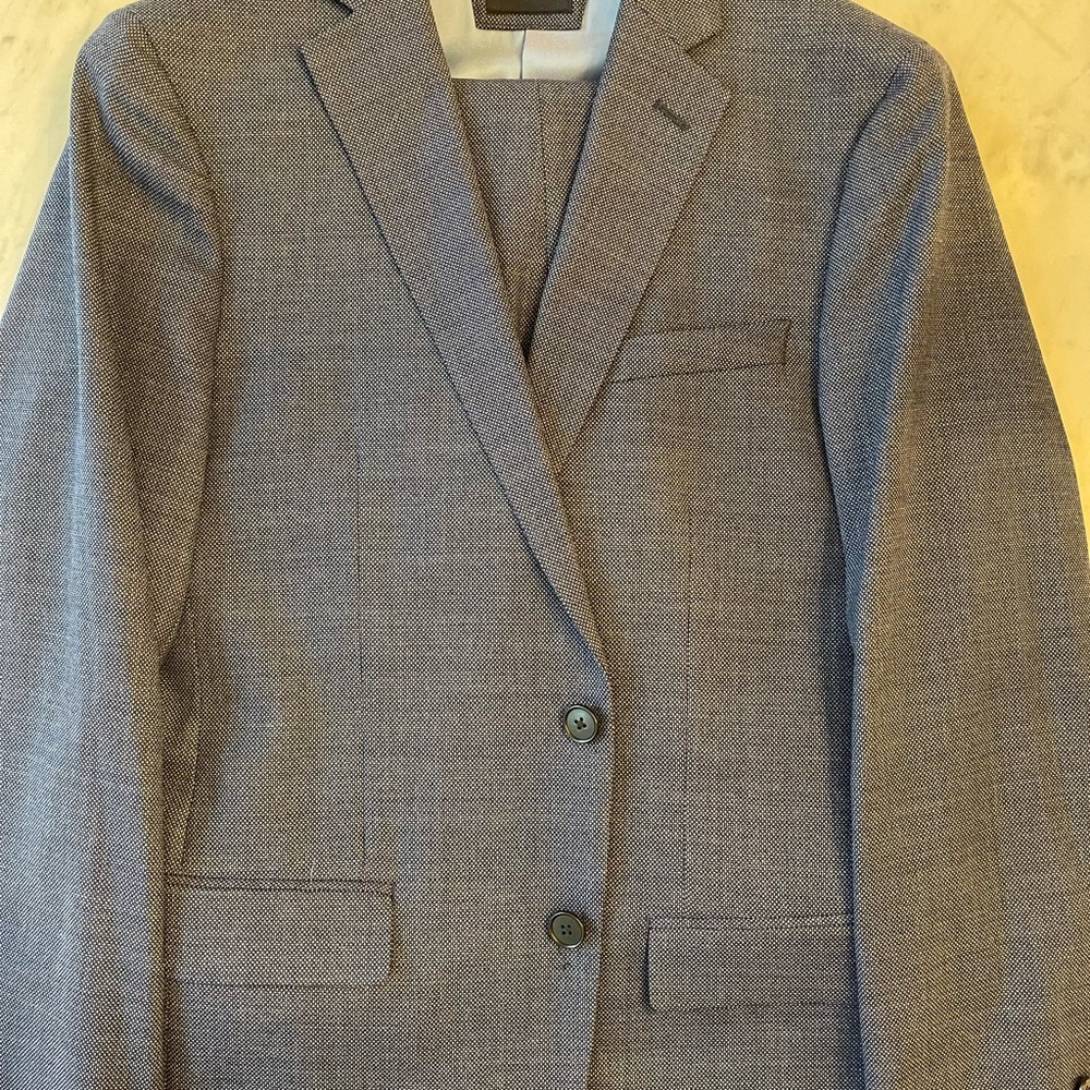 Two-piece penguin suit in blue. Coat is 40 regular and pants are 33/30.